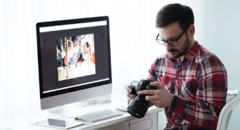 A photo of a man editing photos from his digital camera