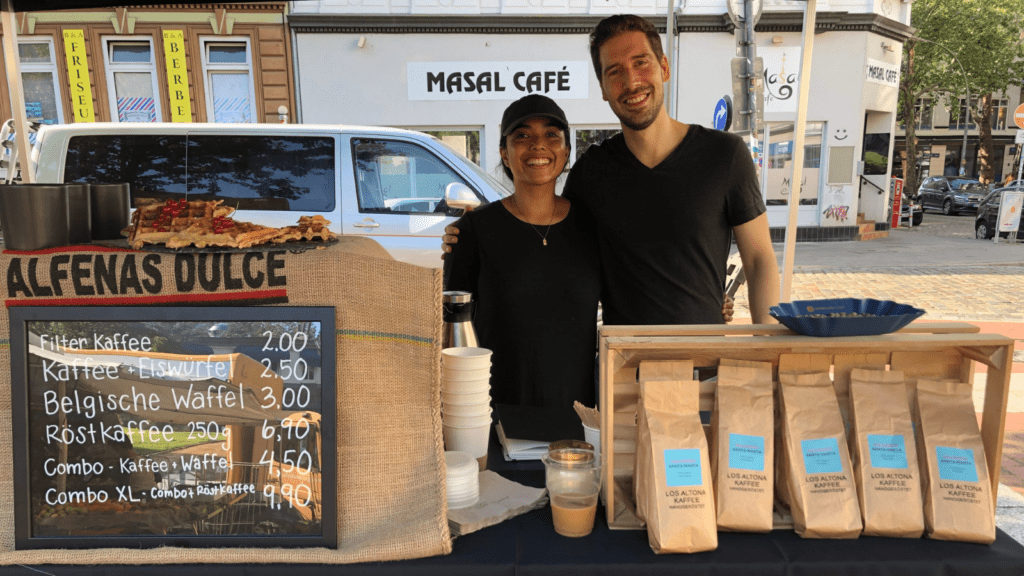 Amanda and her husband selling coffee